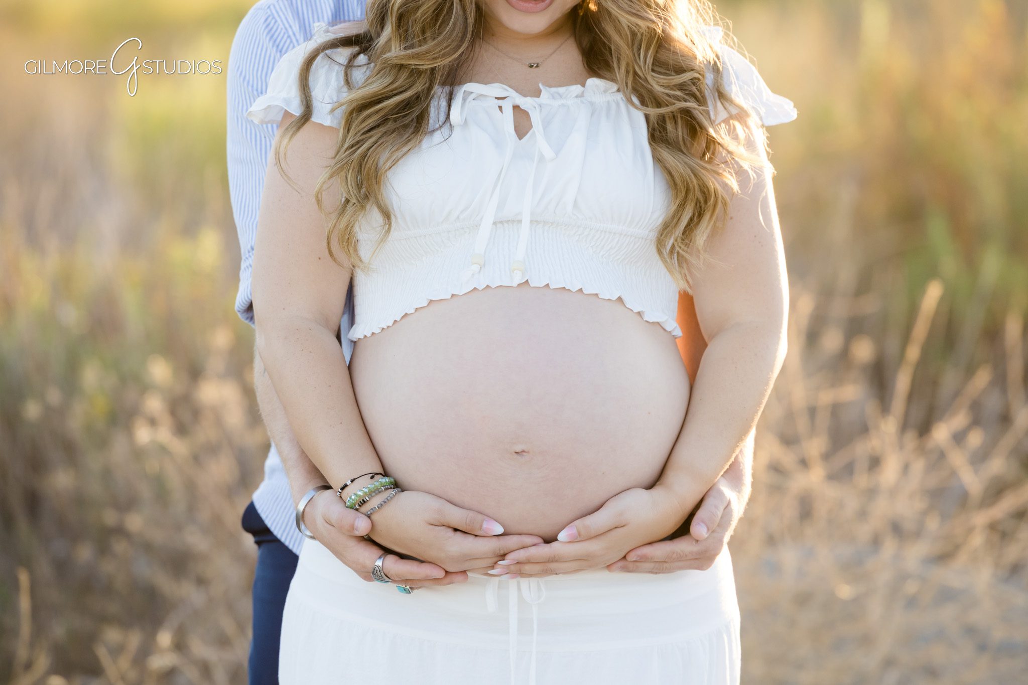 Maternity session at Newport Beach Back Bay with surprise engagement moment
Expecting mother reacting to surprise proposal during maternity portraits