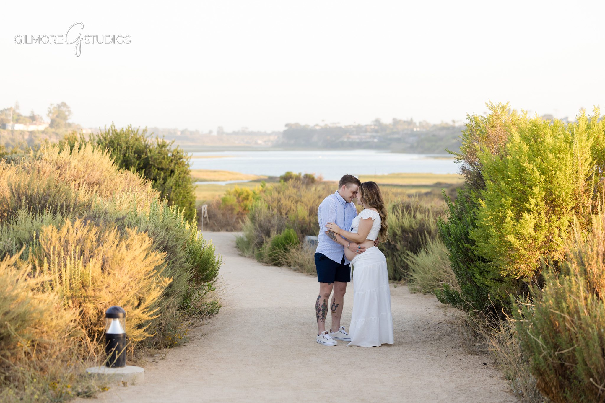 Engagement and maternity photos in Newport Beach with soft sunset light
Surprise proposal during maternity session with ring on baby bump
