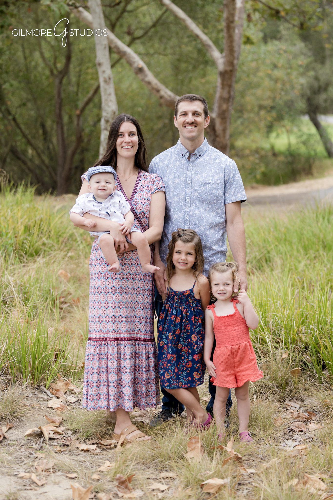 Costa Mesa family photographer capturing grandparents and grandchildren outdoors
Multigenerational family portrait with soft neutral wardrobe at Canyon Park