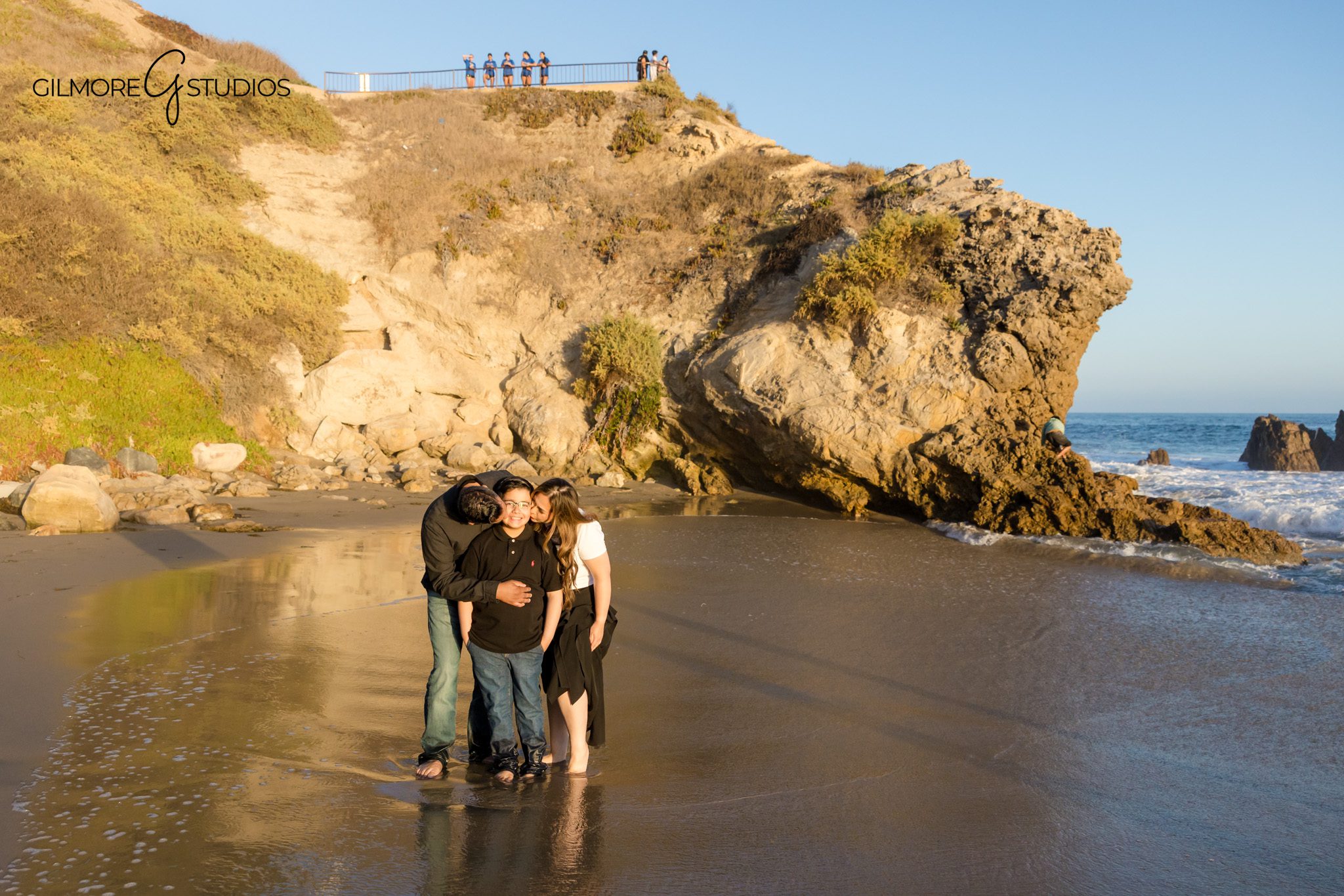 Big Corona Beach family session with cliffs, ocean, and soft evening light
Family of three photographed at Big Corona Beach during golden hour