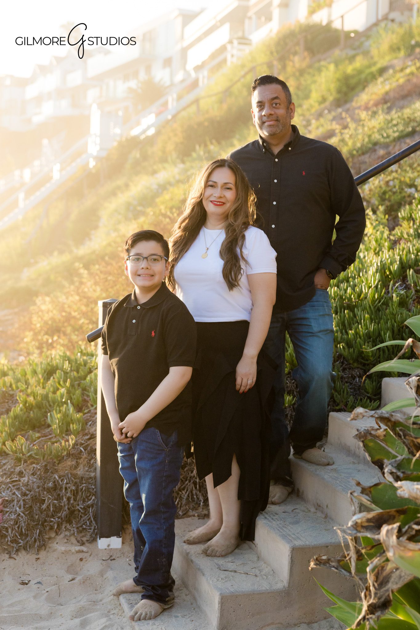 Family of three photographed at Big Corona Beach near the water
Big Corona Beach portrait session with warm Southern California light