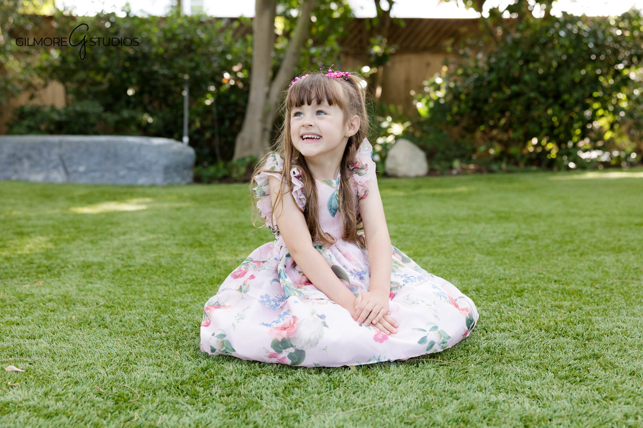 Young girl sitting at tea party table for birthday portraits
Queen Creek studio birthday photos with classic tea party styling