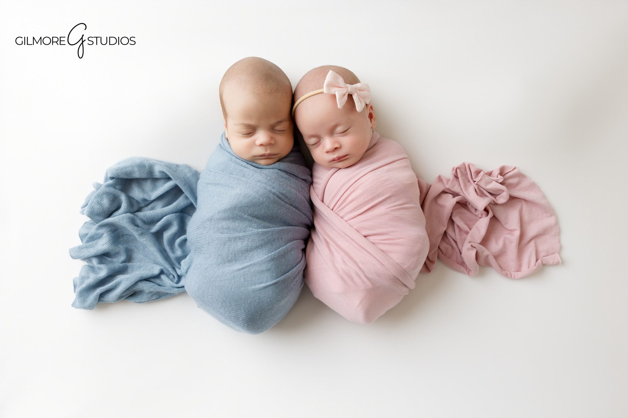 Newborn twins photographer in Gilbert AZ with babies wrapped in white
Twin newborn photos in Gilbert Arizona with soft white studio background