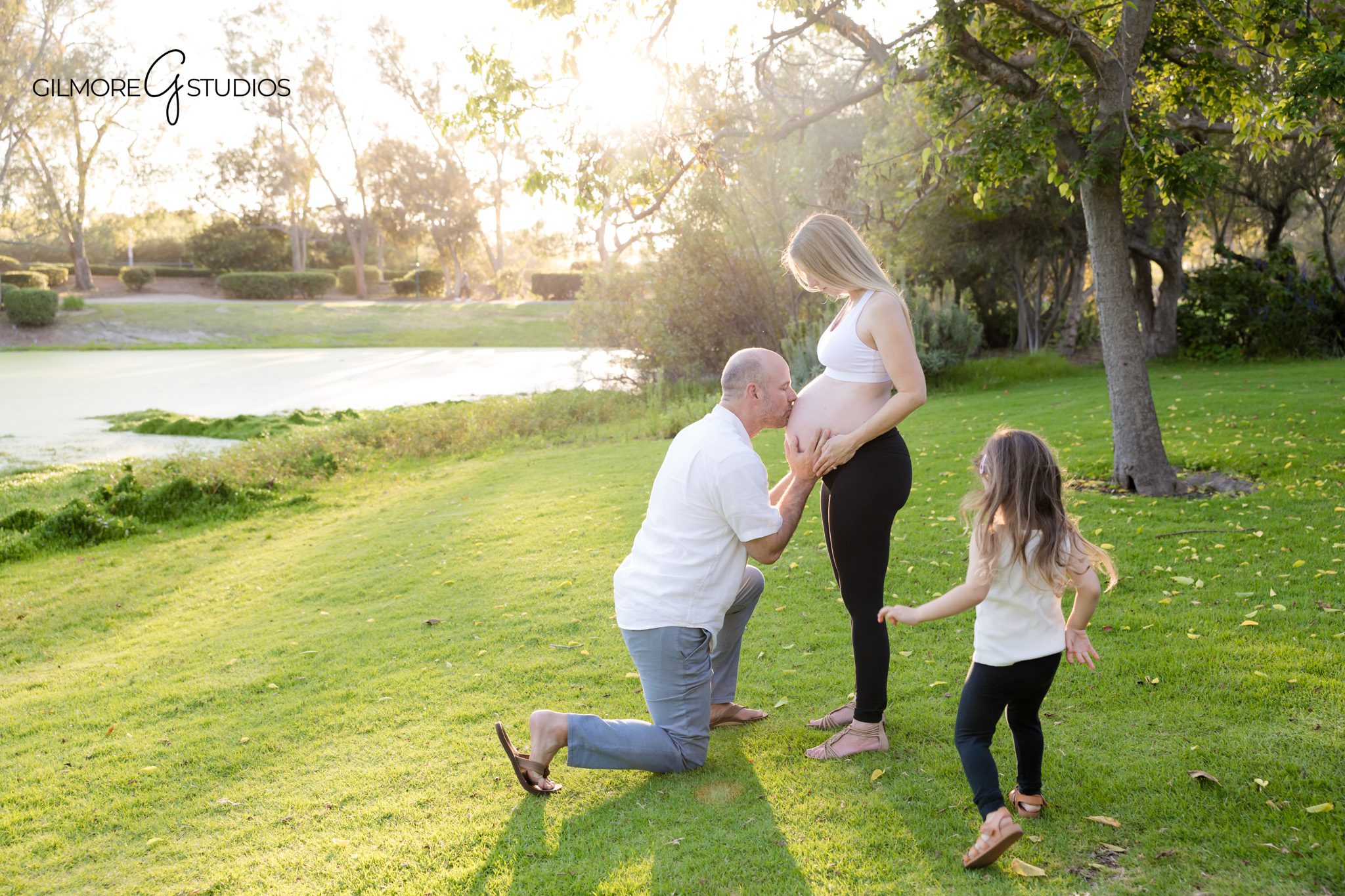 Orange County maternity photographer capturing family in garden setting
Expecting mom and daughter during Huntington Beach maternity photos