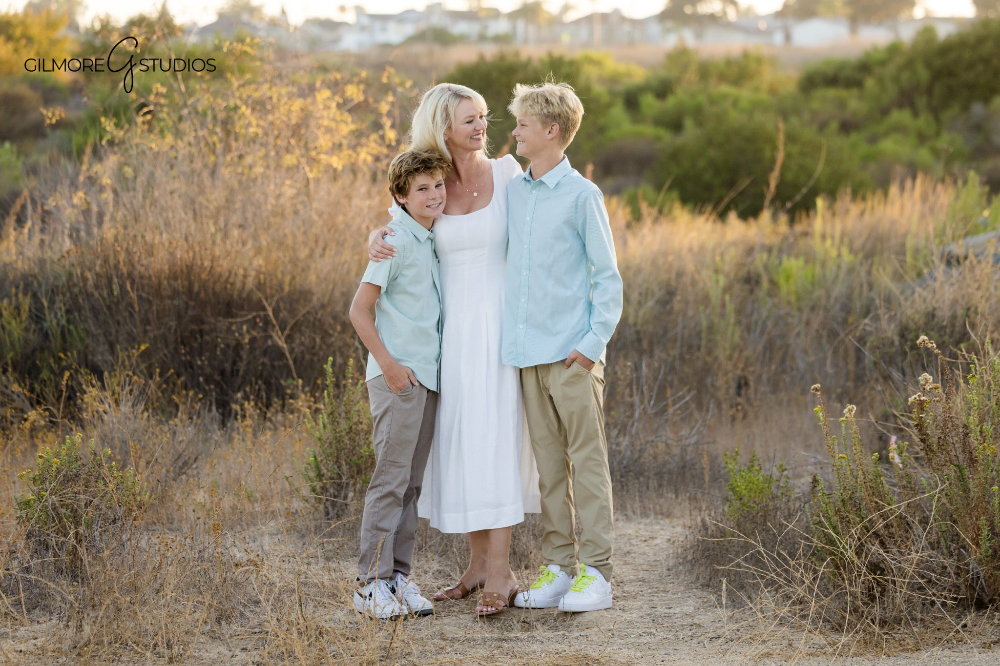 Family of four photographed at Back Bay in Newport Beach
Newport Beach family session with soft blue and white wardrobe