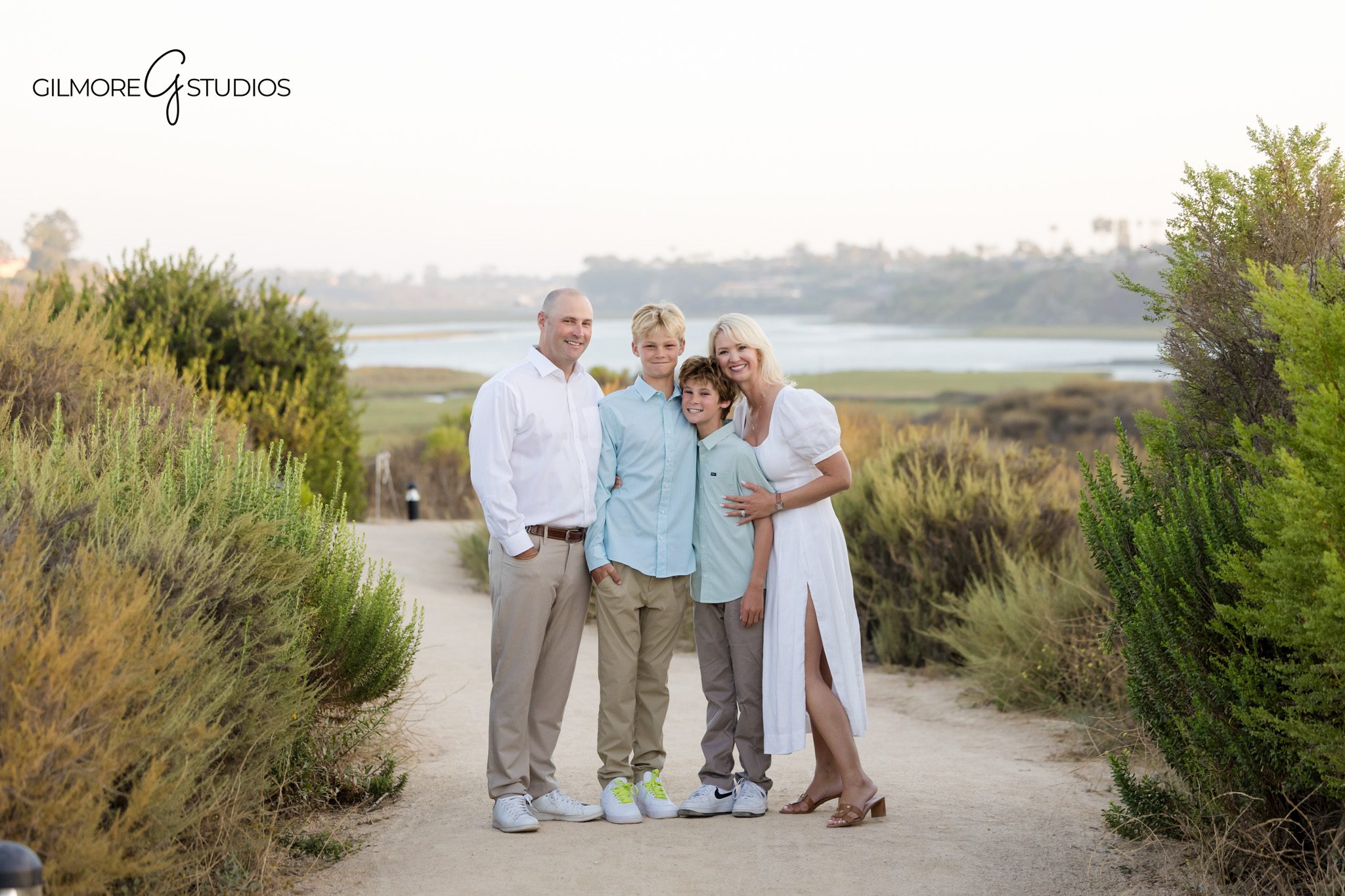 Newport Beach outdoor family photography with coastal landscape
Family standing among golden grasses at Back Bay