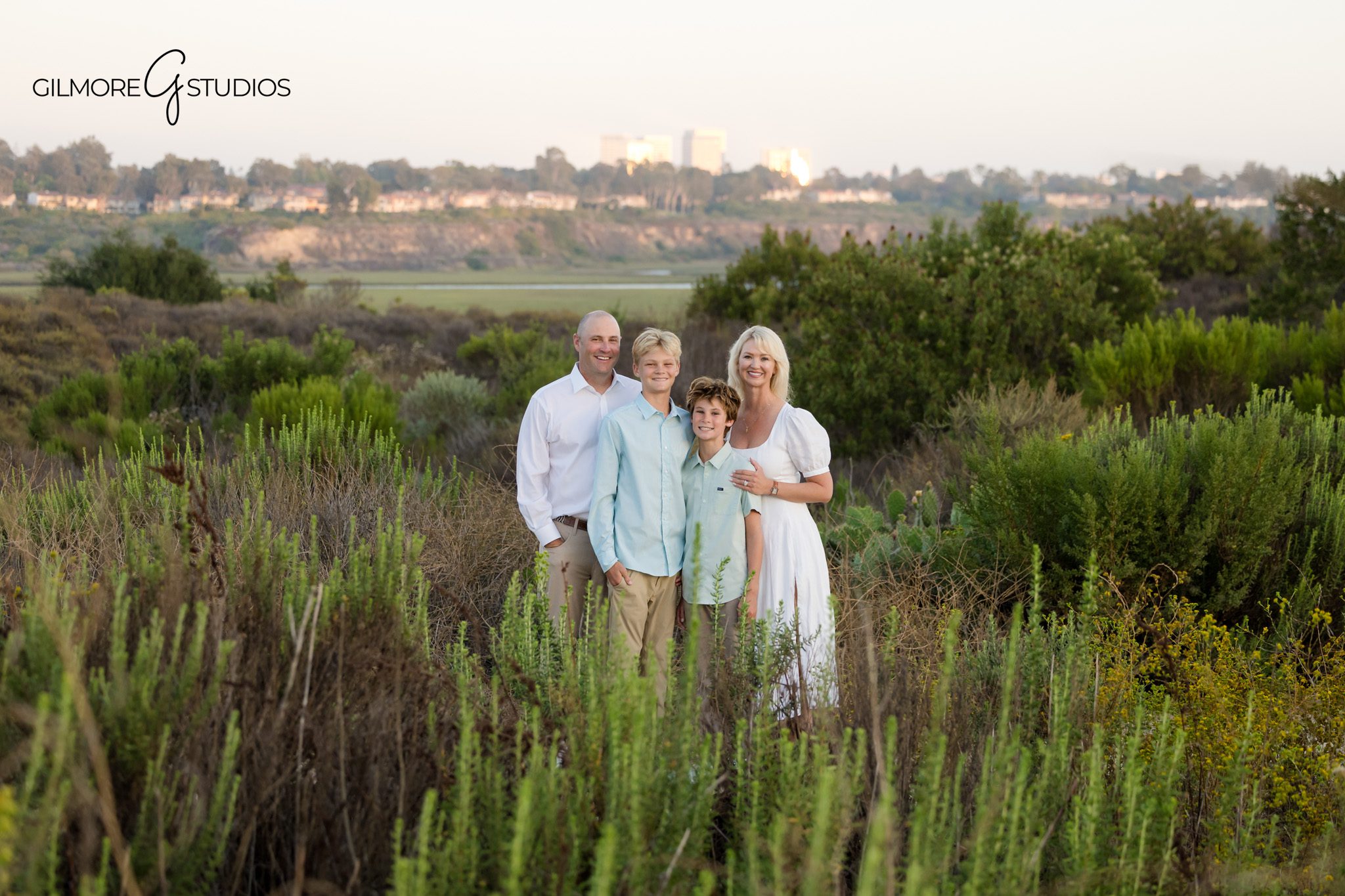 Back Bay family session with warm light and candid connection
Newport Beach family photographer capturing family hugs at Back Bay
