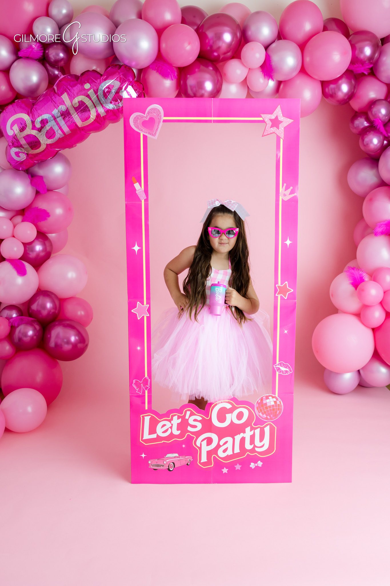 Five year old birthday photoshoot with Barbie inspired pink studio set
Gilbert birthday photographer capturing pink Barbie themed portraits