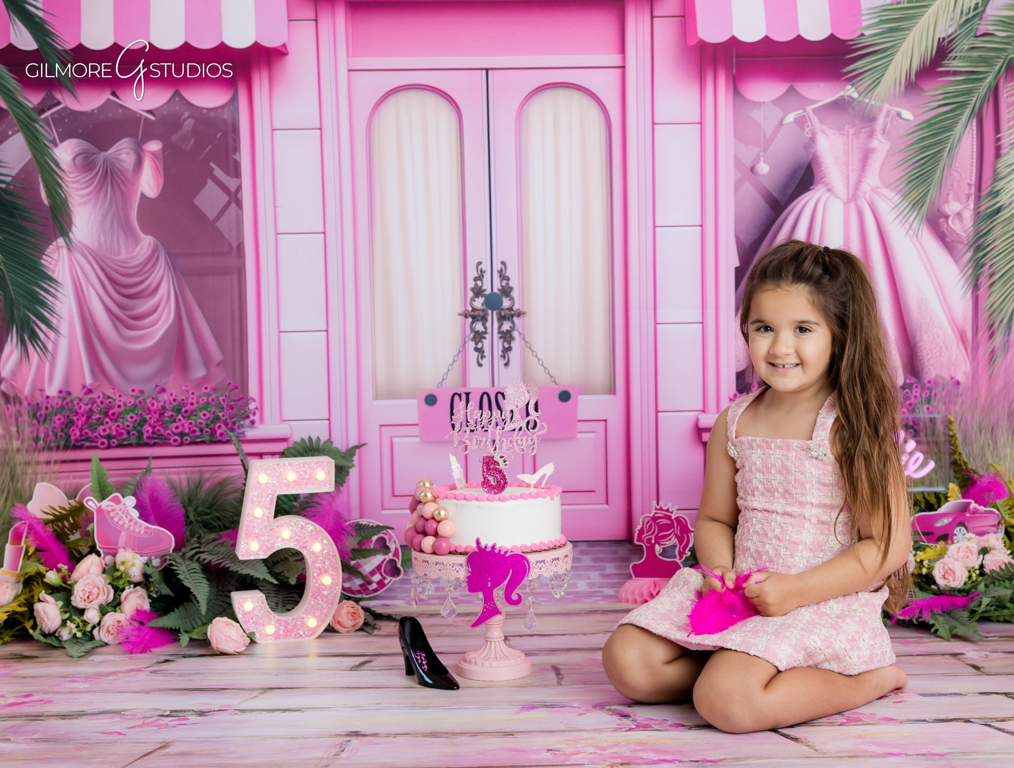 Gilbert AZ kids photographer capturing a Barbie themed studio session
Pink 5th birthday photoshoot with balloons, sunglasses, and tutu dress