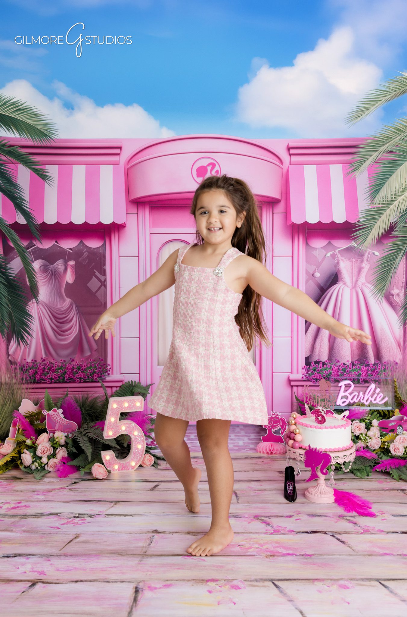 Barbie themed birthday setup with pink balloons and silver accents
Kids birthday photographer in Gilbert AZ capturing personality portraits