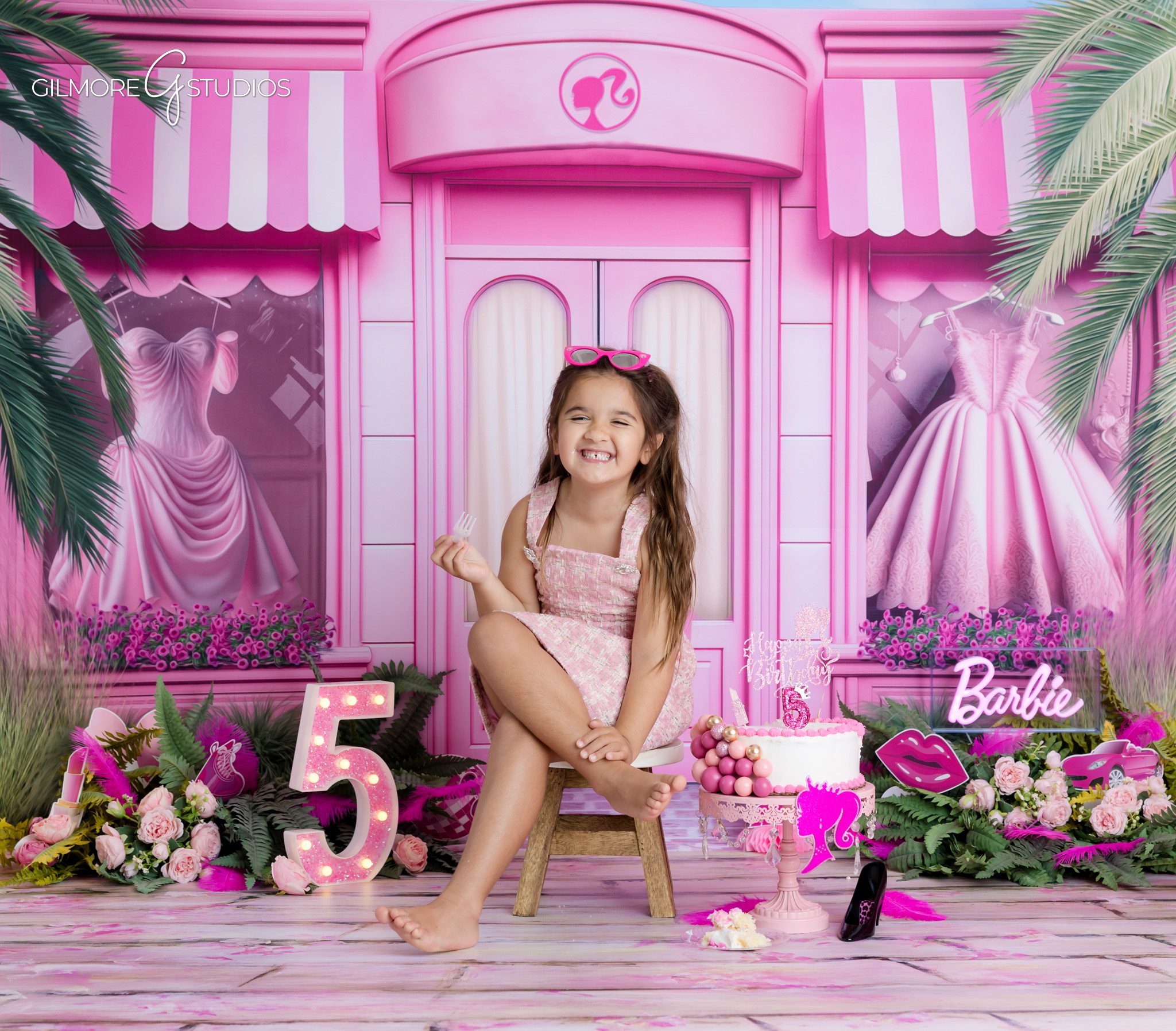Gilbert AZ 5th birthday photographer capturing Barbie themed birthday photos
Barbie themed birthday photos in Gilbert AZ with pink balloon backdrop