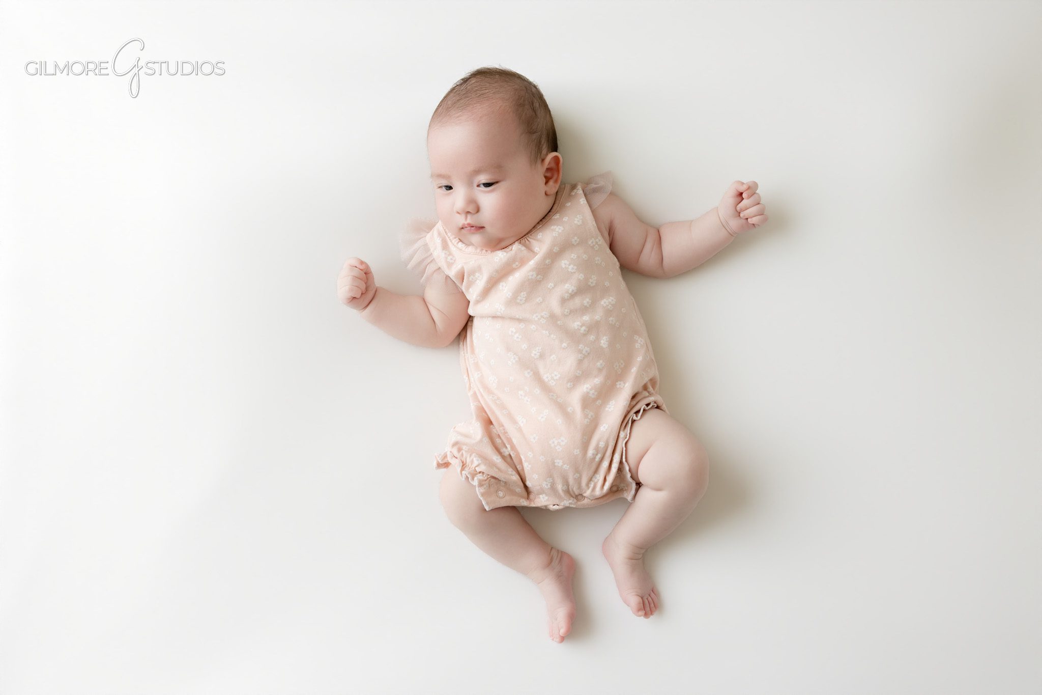 Queen Creek AZ newborn photographer capturing baby photos past the newborn stage
Two month old baby photos with dad and older sibling in studio