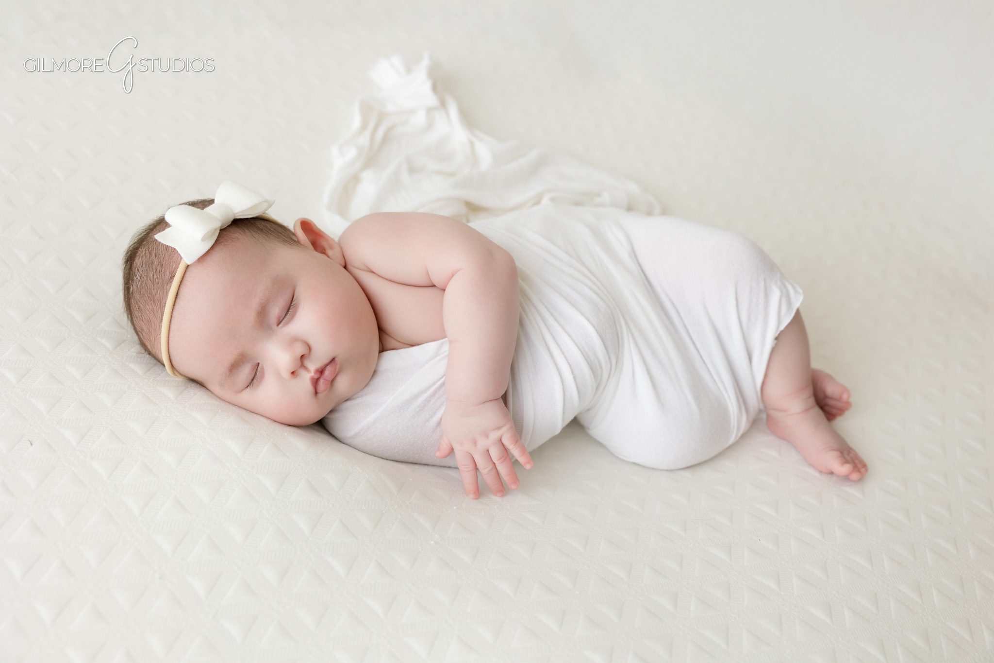 Simple baby photo with felt balloons and white studio backdrop
Queen Creek AZ newborn photographer using neutral props for baby portraits