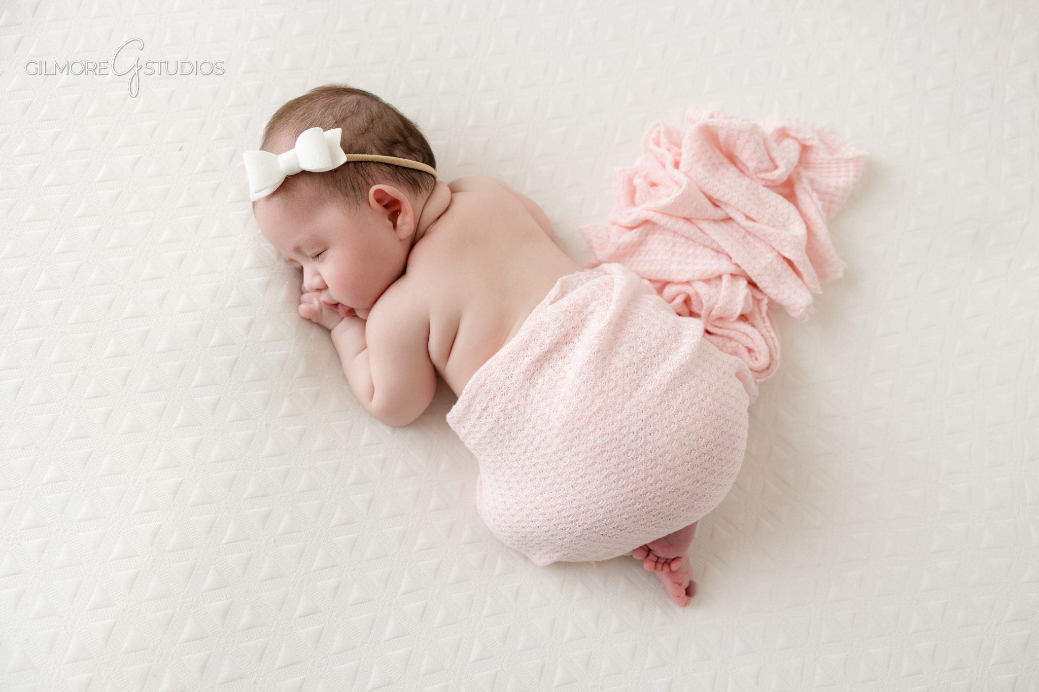 Queen Creek AZ newborn photographer capturing wrapped baby photos
Two month old baby girl wrapped in white for newborn inspired photos