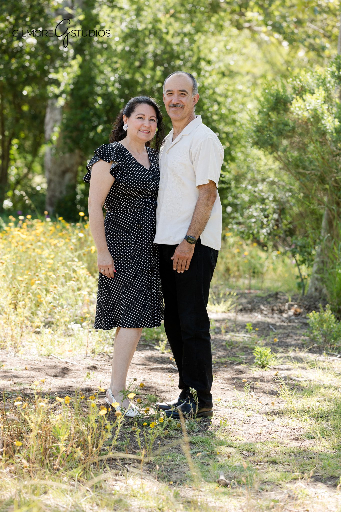 Extended family photos with grandparents as the center of the portrait
Canyon Park family portraits with spring greenery and tall trees