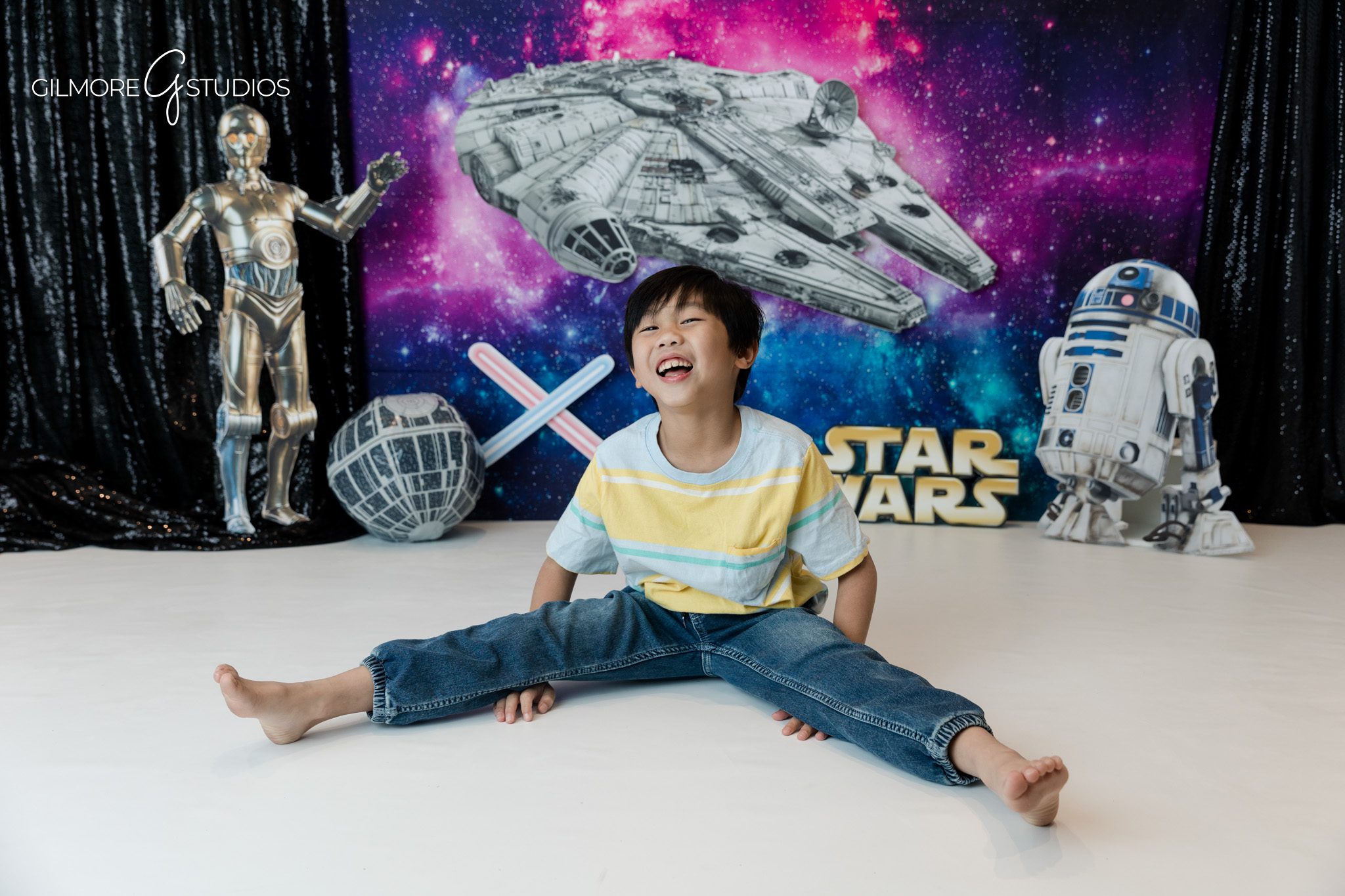 Birthday portrait with child sitting on white studio floor
Space inspired birthday photos for kids in Orange County