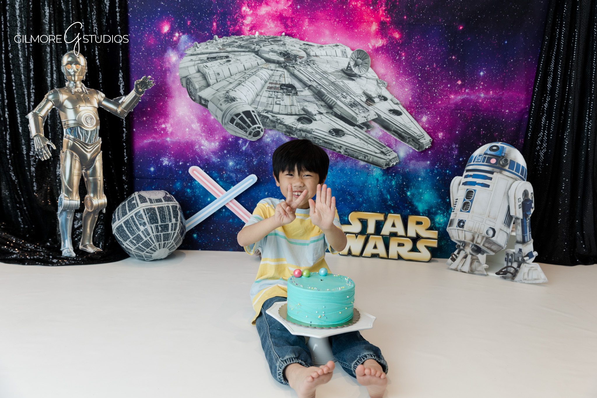 Newport Beach kids photographer with creative birthday backdrop
Themed birthday session with spaceship and galaxy decor
