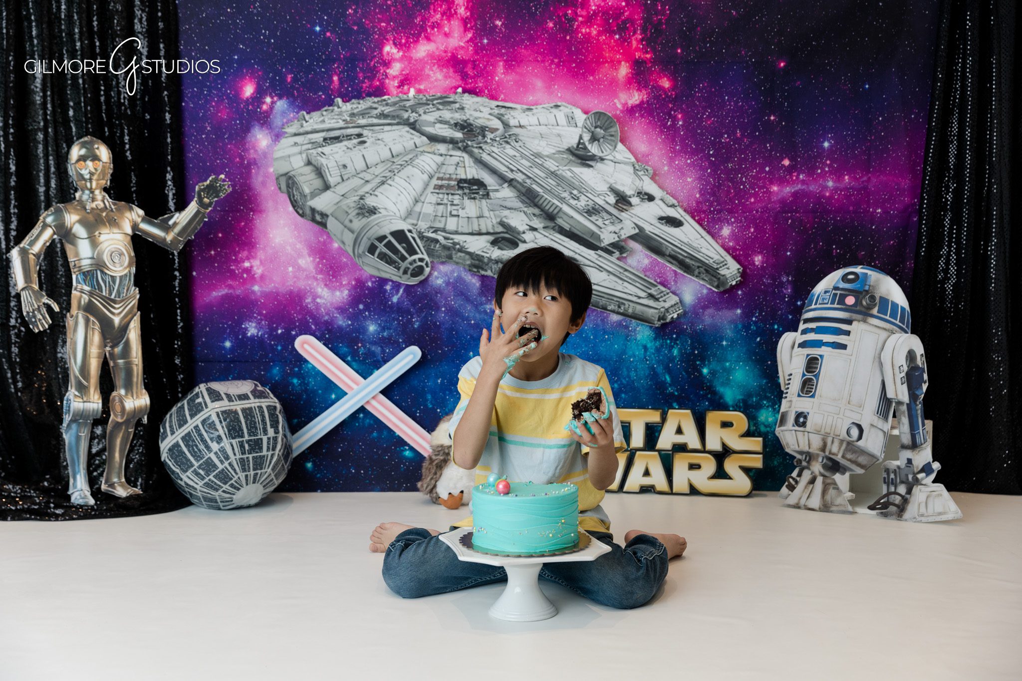 Boy laughing during space themed kids photography session
Playful birthday portrait with galaxy backdrop in Newport Beach