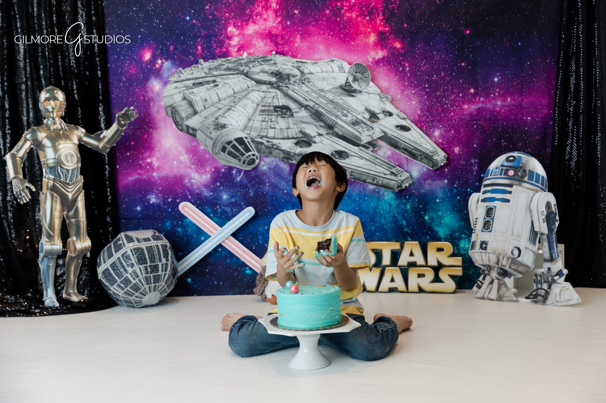 Newport Beach themed photo session for child’s birthday
Child laughing in front of space adventure birthday setup