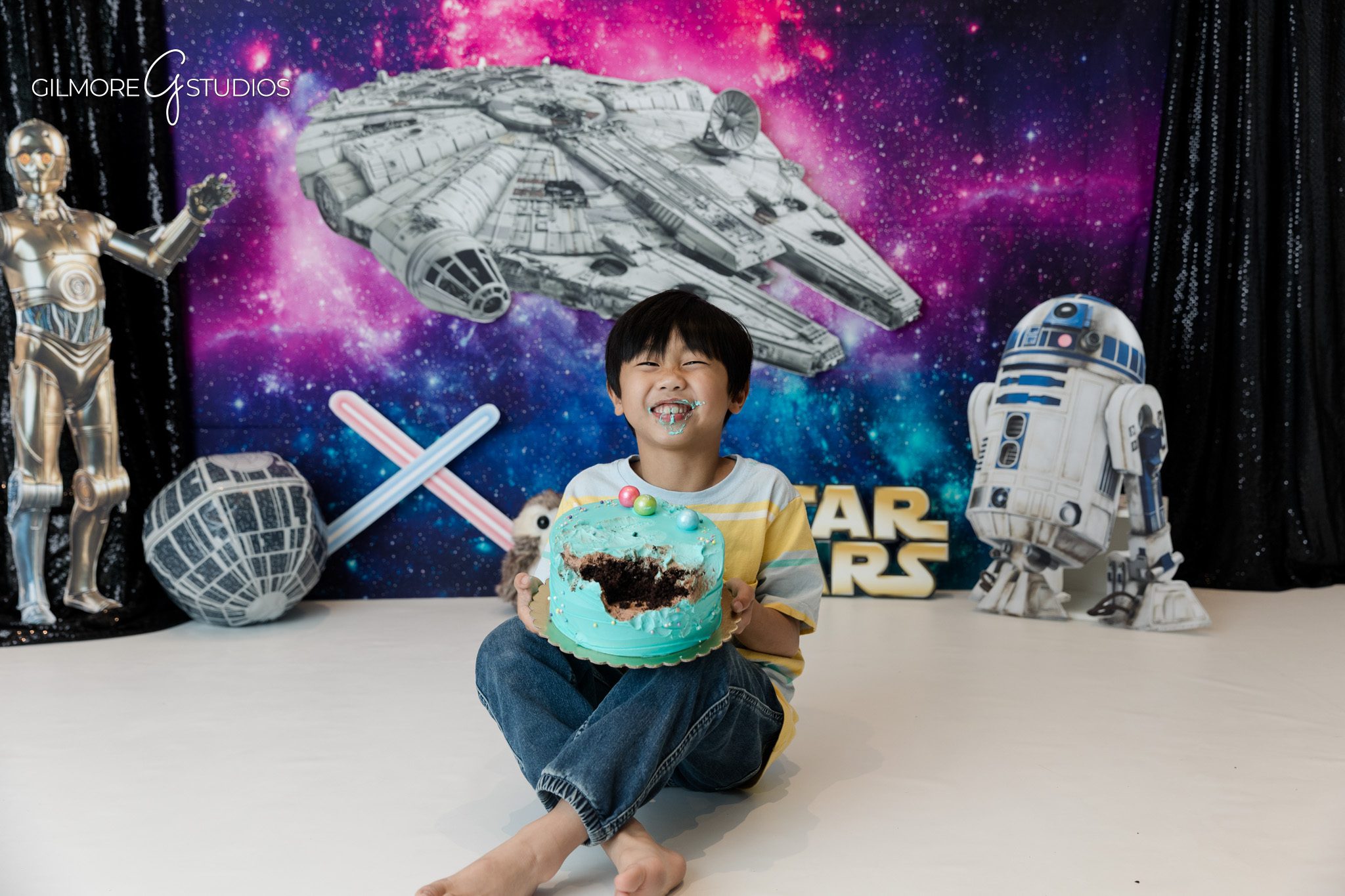 Boy smiling during Newport Beach kids photography session
Child portrait with space adventure birthday theme