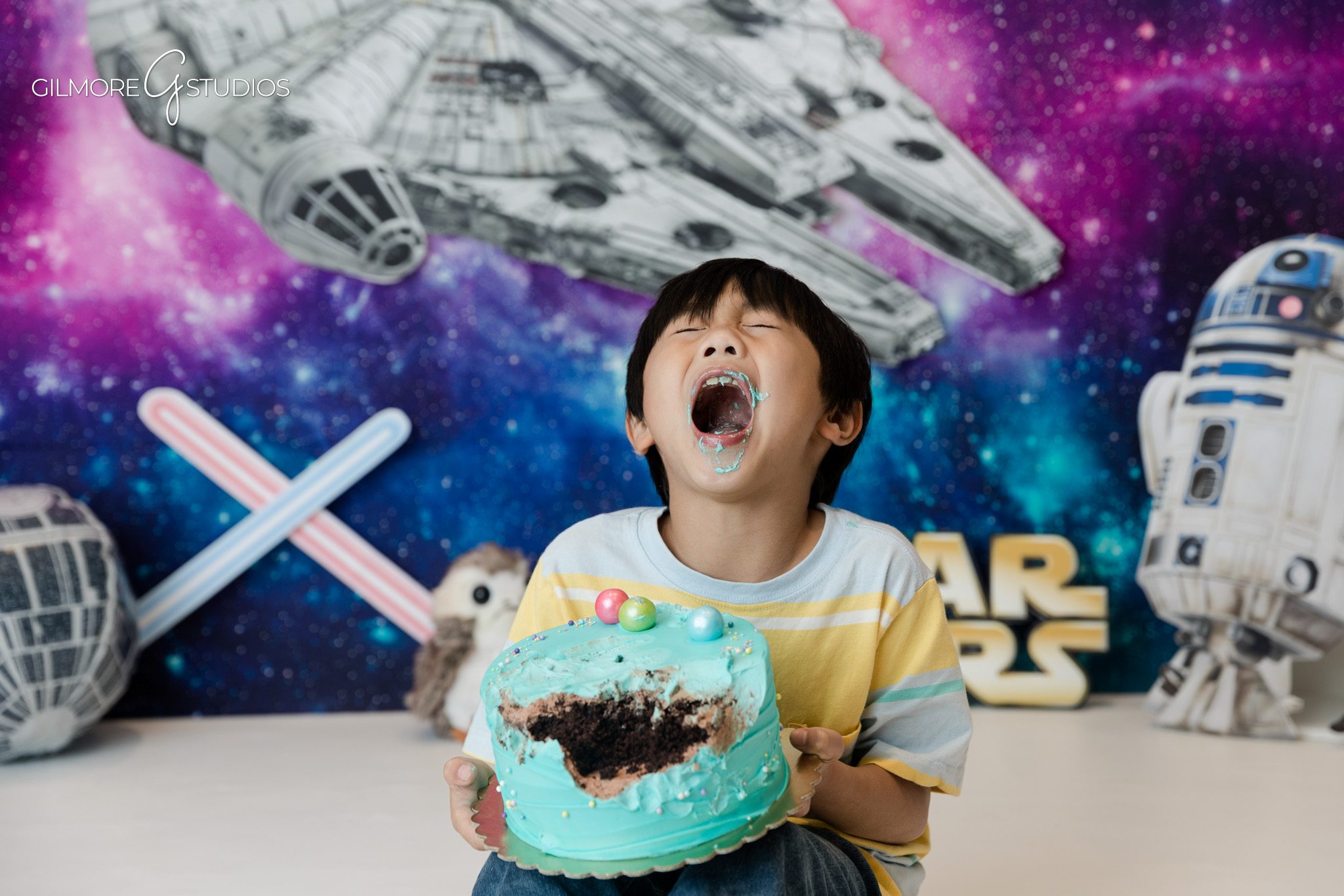 Orange County children’s photographer capturing birthday milestone
Child lying on studio floor during space themed photos