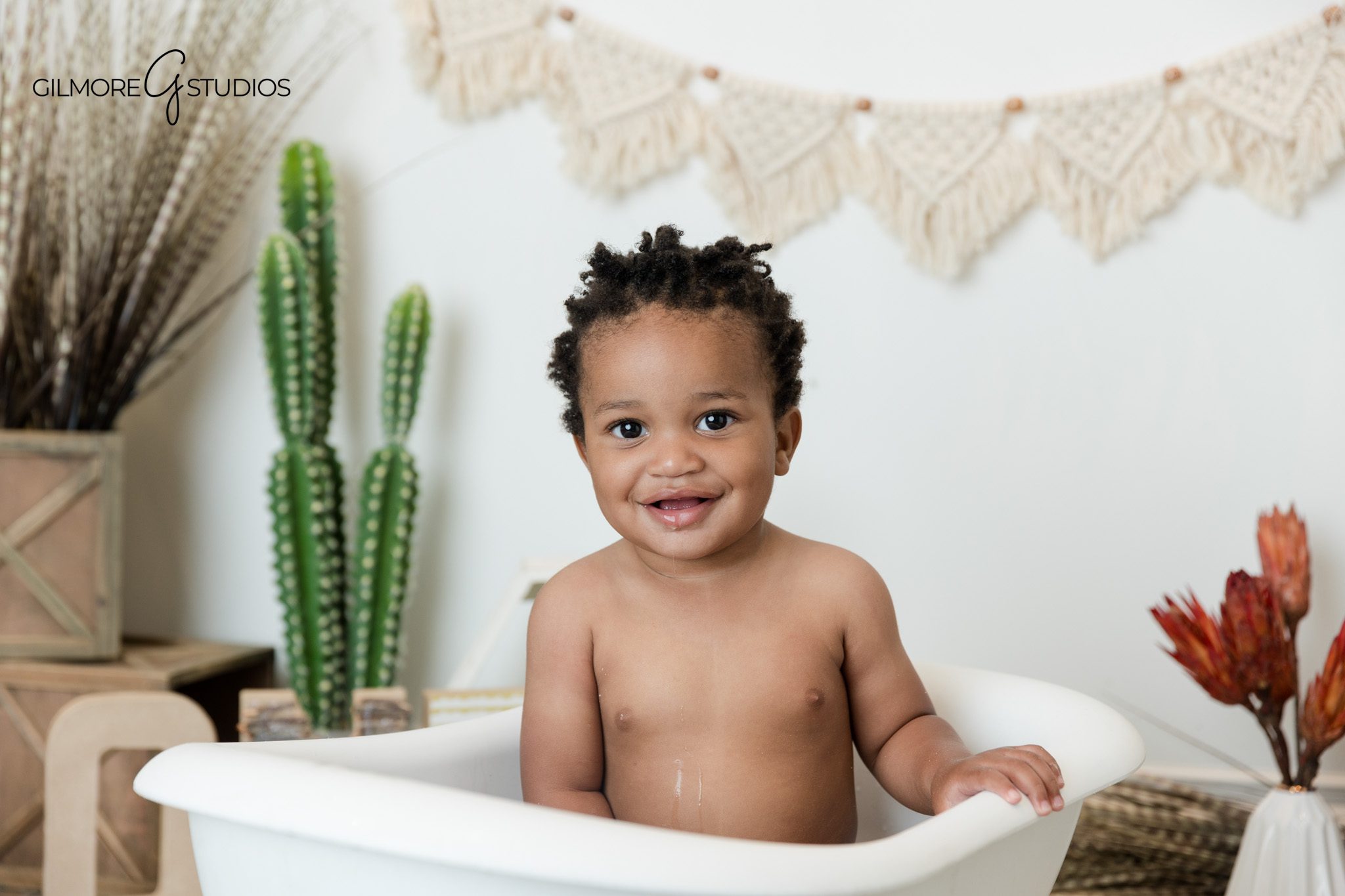 First birthday portrait session with soft greenery and natural light
Newport Beach milestone photography for baby boy turning one