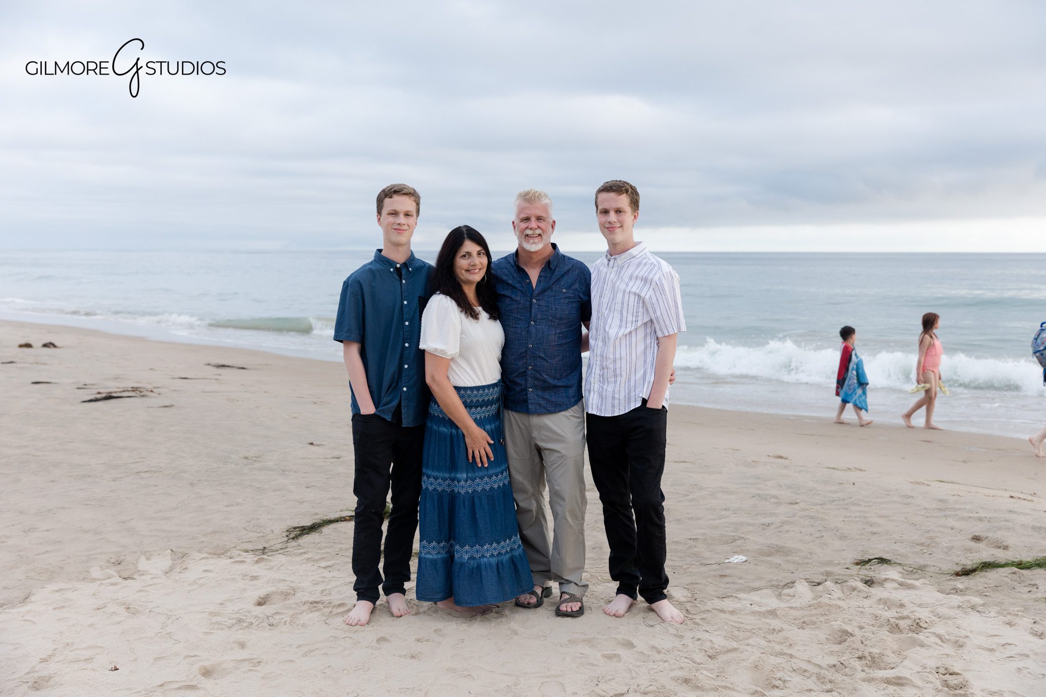 Family portrait at Crystal Cove with parents and twin senior sons
Newport Beach family and senior portrait session on the beach