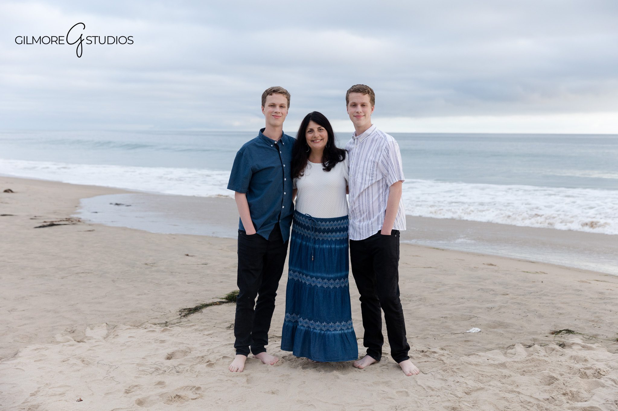 Senior twins photographed with parents at Crystal Cove
Coastal family portrait with older sons in Newport Beach