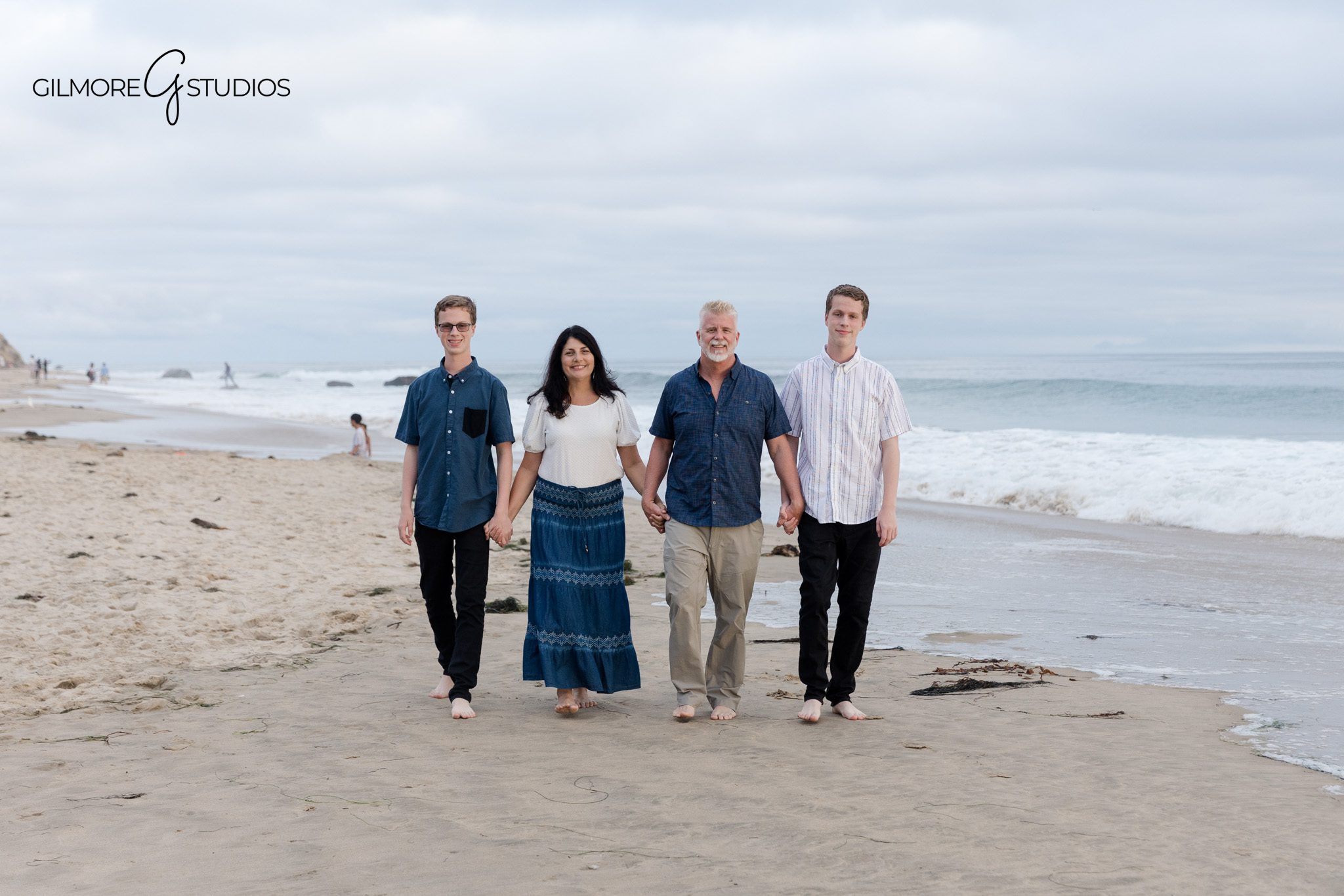 Senior twin portraits with calm ocean background
Crystal Cove senior photos with coordinated coastal outfits