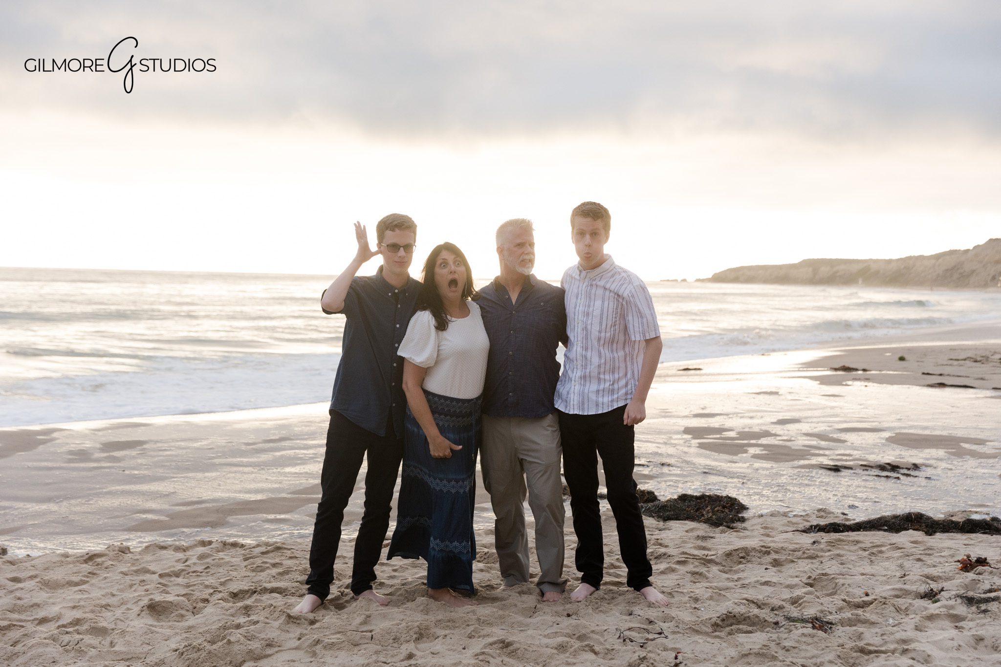 Crystal Cove senior portraits with family along the shoreline
Twin senior photography session with parents by the ocean