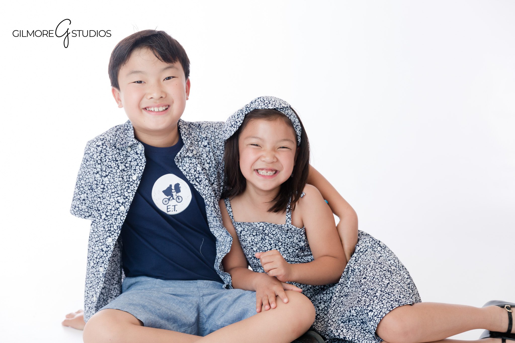 Newport Beach children's photography with playful brother and sister portraits
Brother and sister holding hands during a garden portrait session