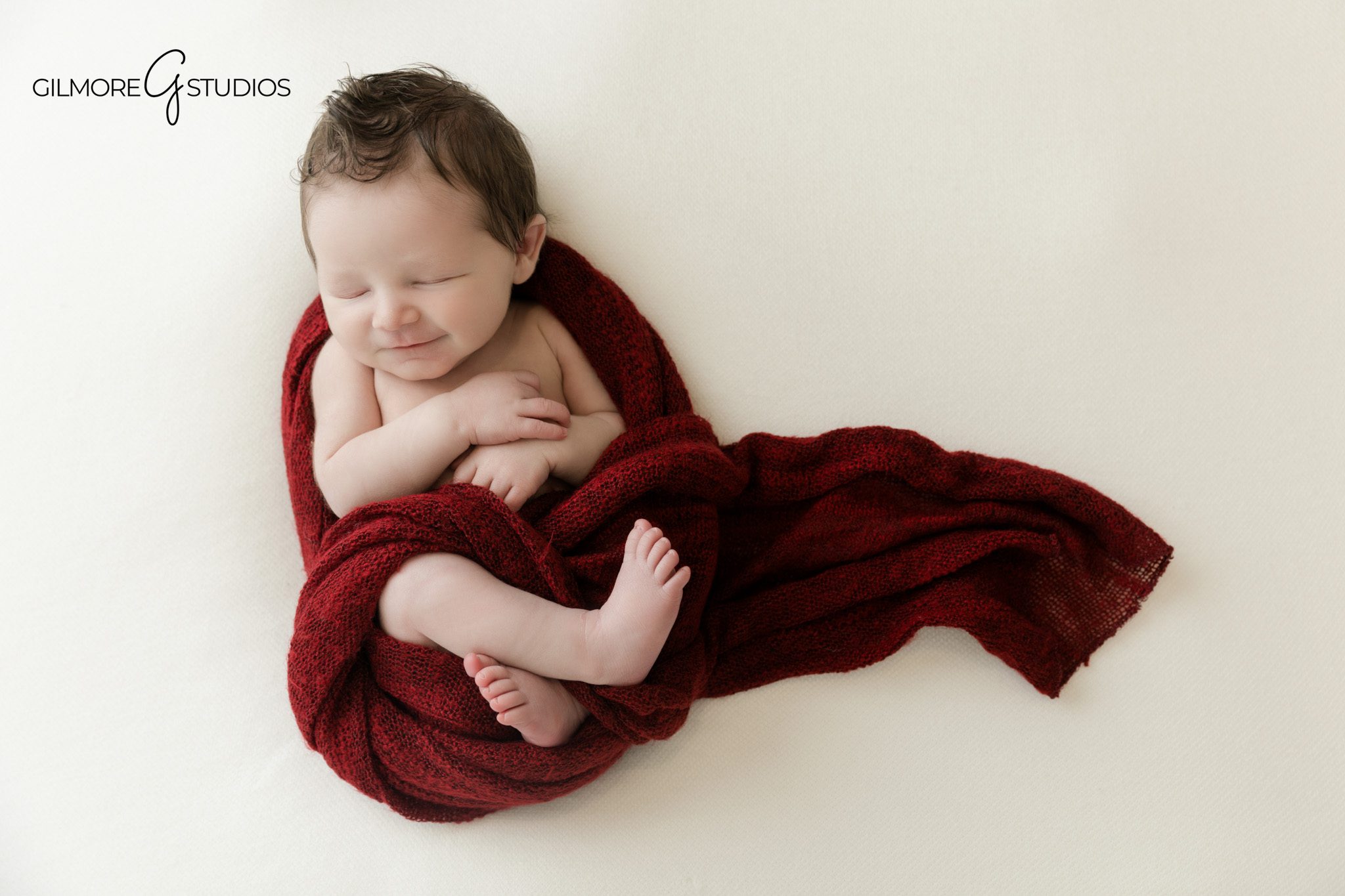 Father holding wrapped newborn during studio newborn session
Queen Creek newborn photographer capturing dad and baby