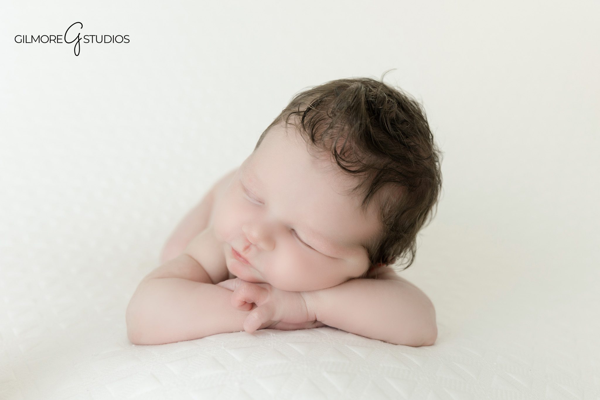 Studio newborn portrait with father holding baby close
Newborn baby in dad’s hands during Queen Creek session