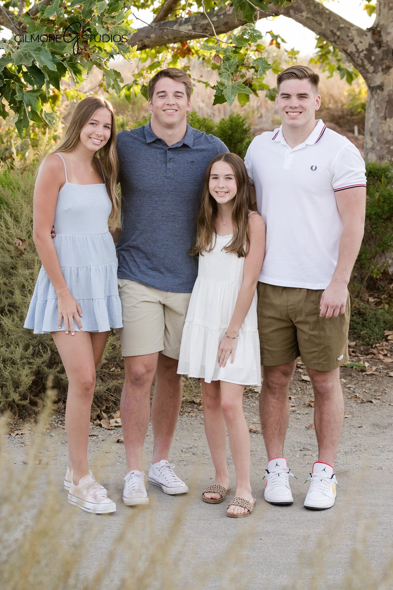Family photos at Newport Back Bay with ocean view in the background
Newport Back Bay family portraits on wooden boardwalk at sunset