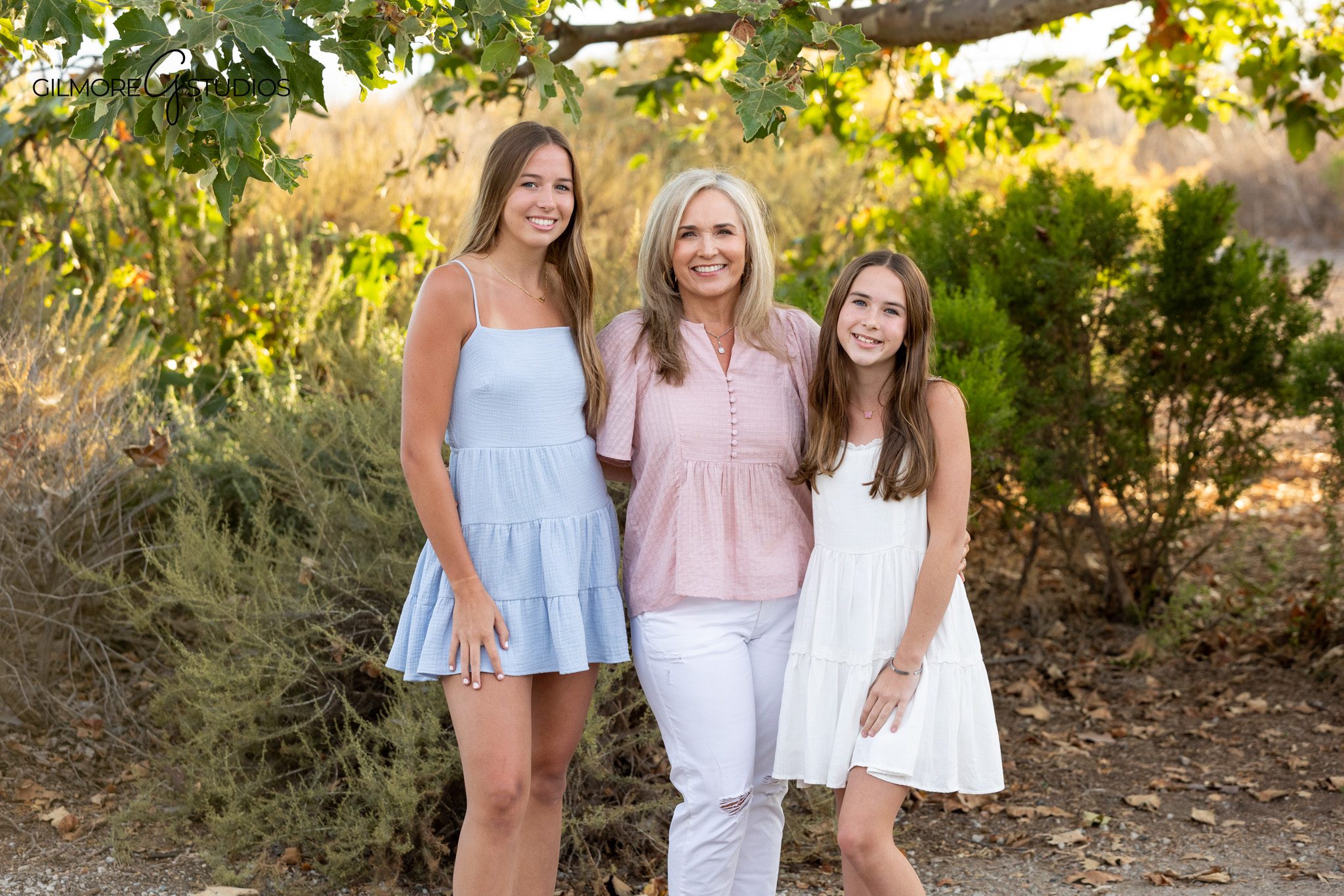 Family portrait with soft sunset light and ocean views at Newport Back Bay
Newport Beach family photos with natural grasses and coastal backdrop