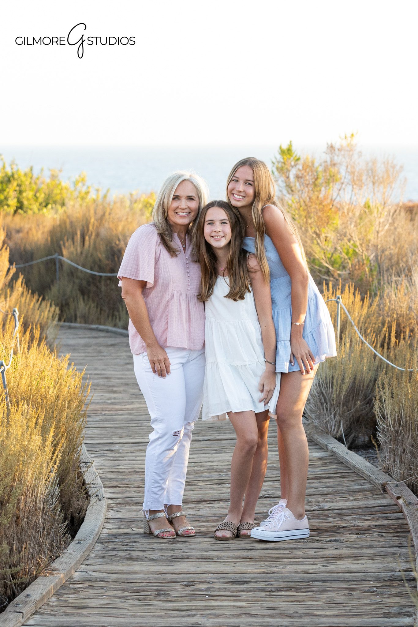 Newport Beach family photos with soft pink and blue wardrobe
Mother daughter portraits on Back Bay trail in Newport Beach