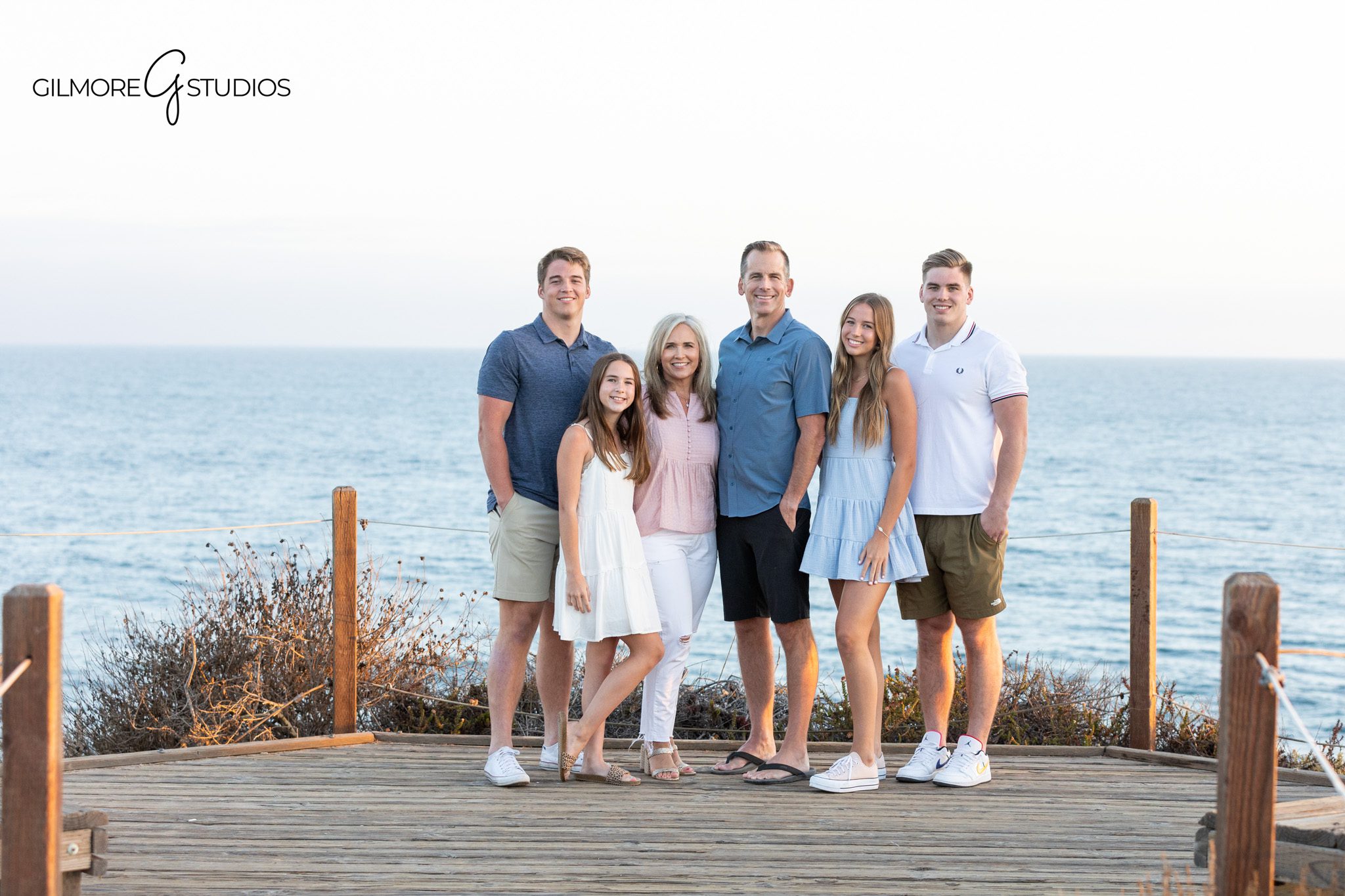 Newport Beach family photographer capturing dad and older boys
Father son family portrait with greenery and warm evening light