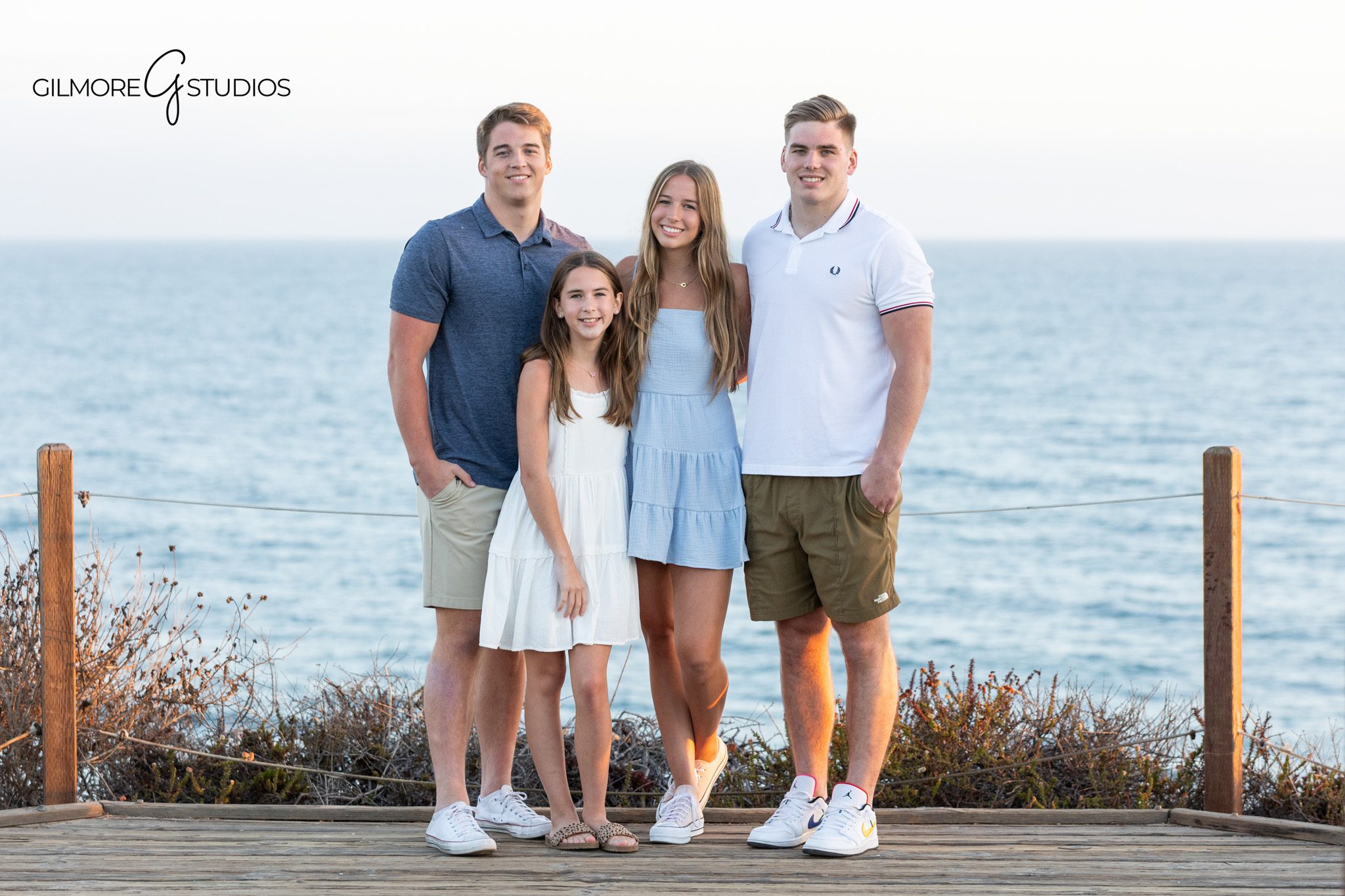 Brothers and sisters smiling together at Newport Back Bay
Family session with older children in a natural Newport Beach setting