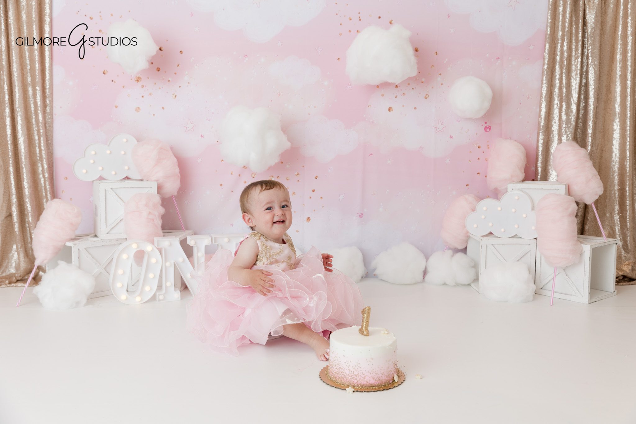 First birthday milestone portrait on clean white background
Baby girl looking up during Newport Beach baby photography session