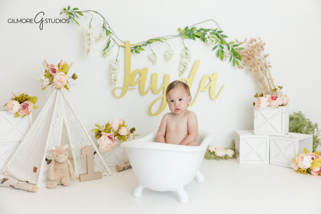 First birthday photos with neutral florals and greenery
Queen Creek AZ milestone photographer for one year old portraits