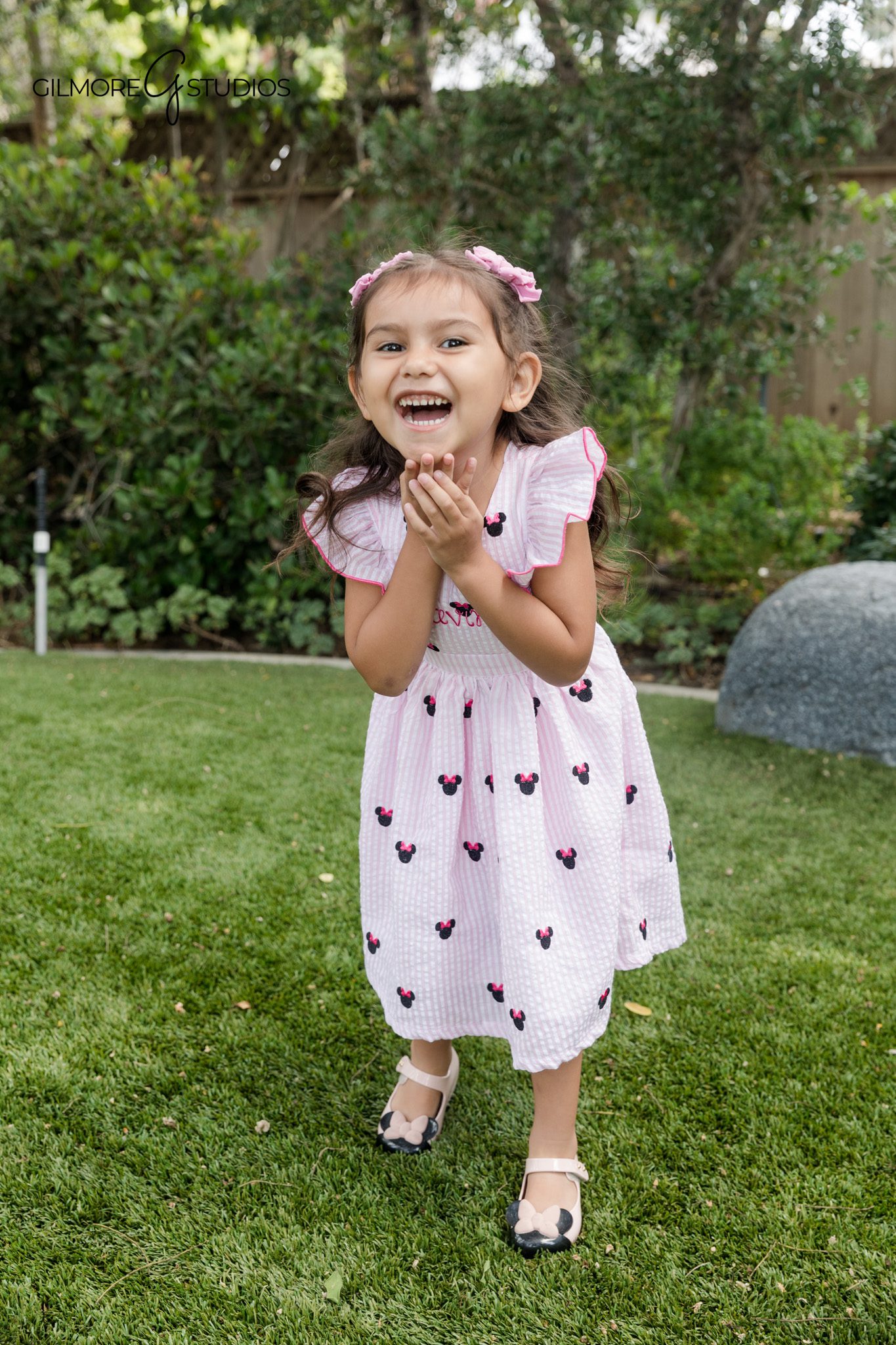 Children’s birthday photographer capturing a playful 4th birthday session
Pink Minnie inspired birthday portraits with gold and white decor