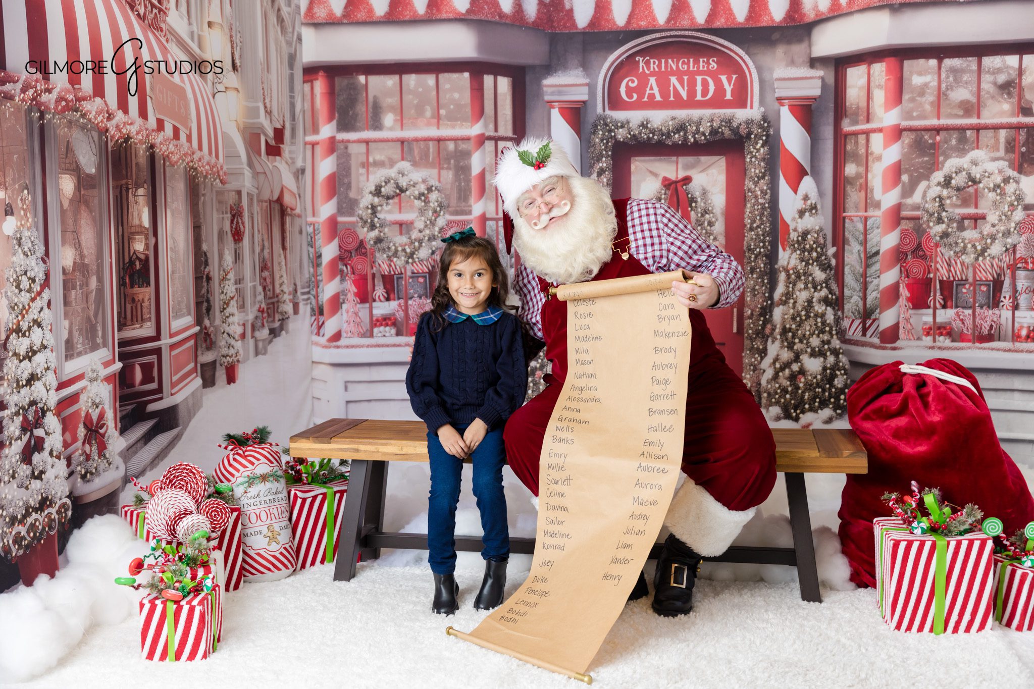 Family Santa photo session in Queen Creek Arizona studio
Santa reading to child during Gilmore Studios Christmas mini session
