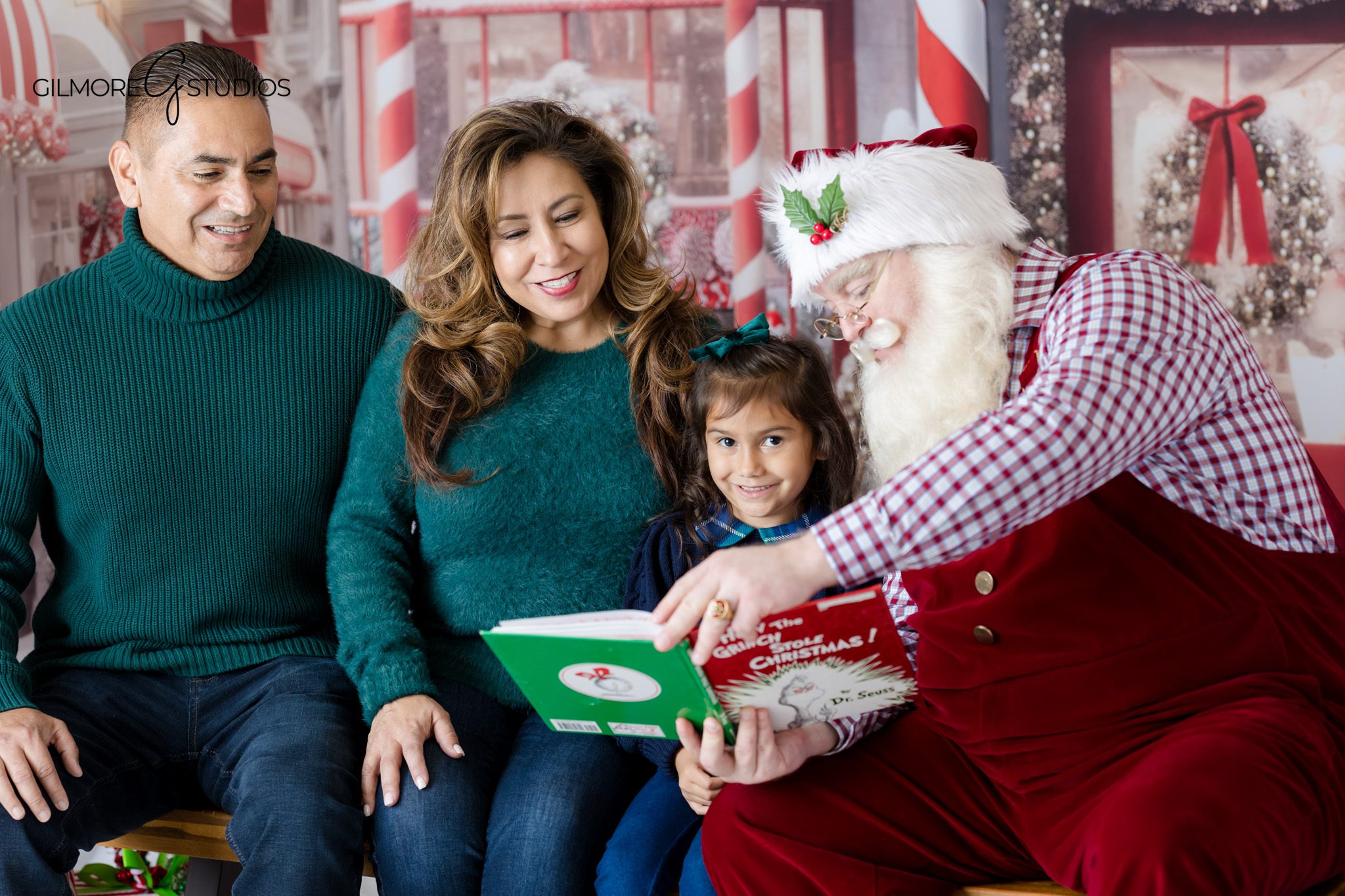 Child and parents sitting with Santa for Queen Creek Christmas portraits
Queen Creek AZ Santa mini session with magical holiday backdrop