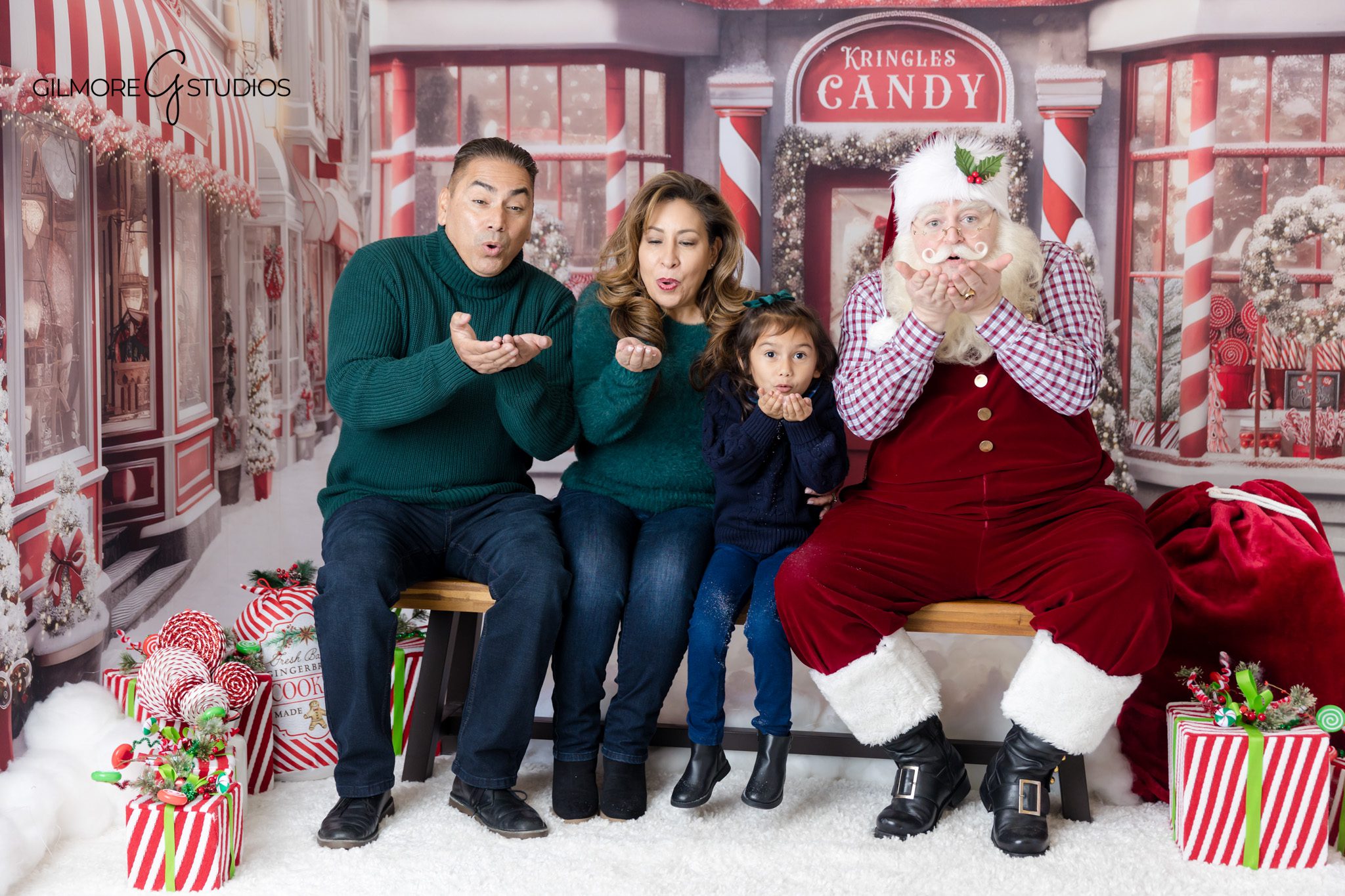 Santa blowing kisses with family during Queen Creek Christmas photos
Family Christmas card photos with Santa in Queen Creek AZ