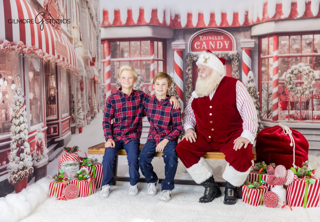Gilmore Studios Christmas portrait with boys and Santa
Santa reading a holiday book with brothers at Gilmore Studios