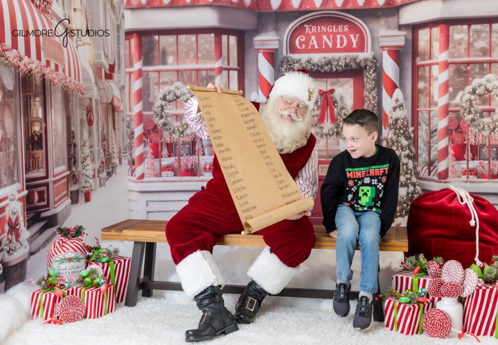Boys sitting with Santa for Christmas photos in Queen Creek
Santa reading with two brothers during Queen Creek mini session