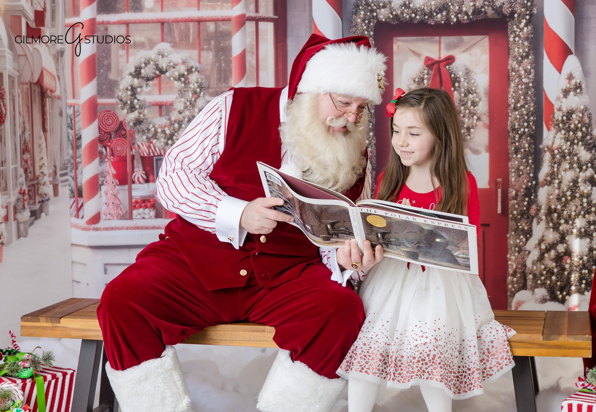 Queen Creek AZ Santa portraits with children reading a Christmas book
Santa reading with two girls during a Christmas mini session