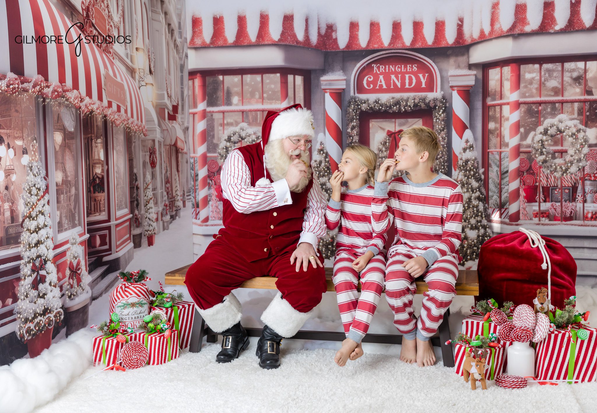 Holiday family photo with Santa and red Christmas backdrop
Gilbert AZ Santa photos for families and children