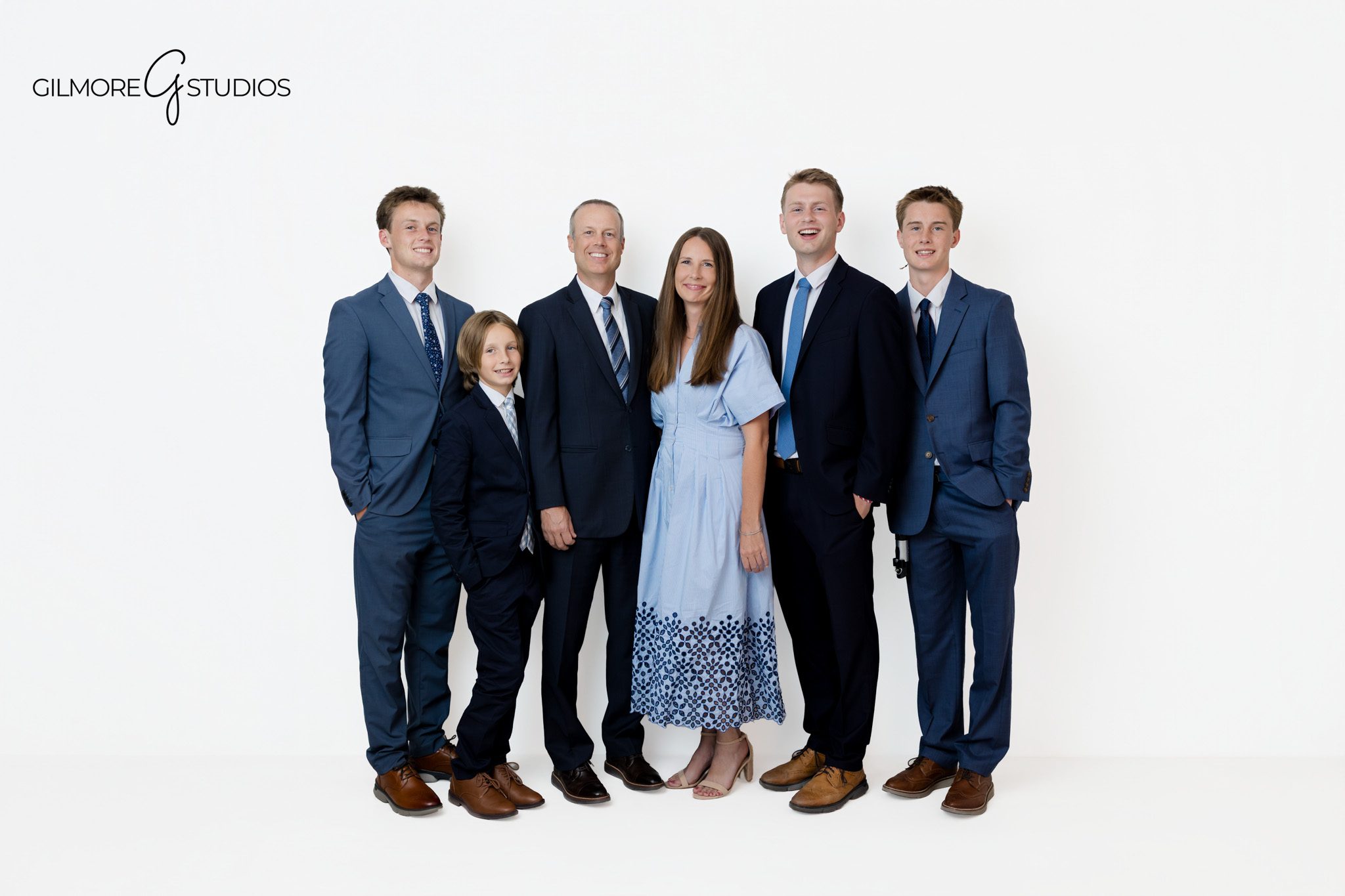 Queen Creek AZ portrait studio session for a family of six
Timeless family photography with older sons and parents in formal attire