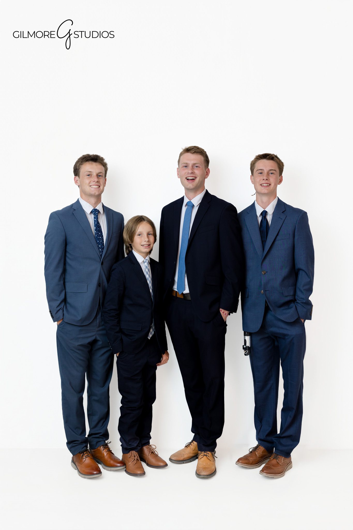 Studio family photo with parents standing between their sons
Family portraits for families entering a new season of life